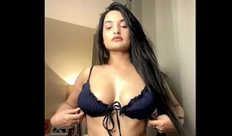 Hindi bf Aditi Mistry shows off her large breasts in a skimpy black bikini.